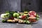 Healthy food clean eating selection. fruit, vegetable, seeds, superfood, cereals, leaf vegetable on rustic background