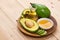 Healthy food concept. Fresh organic avocado oil with honey on ta