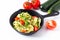 Healthy food concept homemade Guilten-Free Zucchini Noodles, Pasta with tomato in iron skillet pan