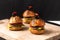 Healthy food concept Homemade mini hamburgers on wooden board with copy space