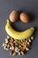 Healthy food concept image, natural food of nuts, banana and boiled eggs