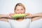 Healthy food concept. Woman hold yellow corn cob white background. Corn harvest. Girl hold ripe corn. Food vegetarian