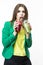 Healthy Food Eating. Woman Drinking With Both Green and Red Detox Vegetable Smoothie. Posing in Green Jacket Over White.