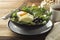 Healthy food. Eggs, quinoa, avocado, green salad, black olives. Wooden table. diet, lose weight