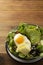 Healthy food. Eggs, quinoa, avocado, green salad, black olives. Wooden table. diet, lose weight