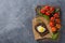 Healthy food flatlay. Vegetables on wooden serving board. Tomatoes. Bread with fried egg. Top view. Free space.