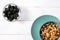 Healthy food: a healthy breakfast of cornflakes and blackberry berries on a white tree table