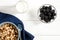 Healthy food: a healthy breakfast of cornflakes and blackberry berries on a white tree table