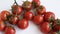 Healthy food ingredient - raw tomatoes on white background, vibrant colours