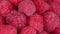 Healthy food organic nutrition. Rotation raspberry macro red fresh raspberries fruit rotation.