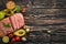 Healthy food. Raw meat, avocado, broccoli, fresh vegetables, nuts and fruits. On a wooden background.