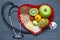 Healthy food on red heart plate