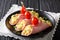 Healthy food: roll ham with stuffed omelette with tomatoes close