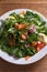 Healthy food: salmon spinach radish cucumber salad.