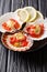 Healthy food seafood: scallops in a shell with sauce, tomatoes a