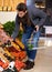 Healthy food, search and man shopping at a supermarket for grocery promotions, sale or discounts deal. Check, fresh or