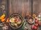 Healthy food and snack background. Bowls with tasty ingredients of Mediterranean cuisine: various vegetables, olives, pickled