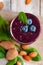 Healthy food and vegan diet concept - fresh juice or smoothie with blueberry, spinach, almond milk. Tasty detox beverage with raw