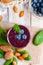 Healthy food and vegan diet concept - fresh juice or smoothie with blueberry, spinach, almond milk. Tasty detox beverage with raw