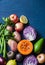 Healthy food vegetables background. Pumpkin, red cabbage, avocado, red onions, kumato tomatoes, celery, apples, potatoes, beets on