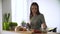 Healthy food. Woman cooking fresh vegetable salad at kitchen