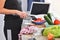 Healthy food. Woman preparing sliced pepper and vegetables