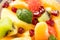 Healthy fresh fruit salad as a background
