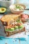 Healthy and fresh sandwich with avocado, salmon and dill