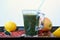 Healthy fresh smoothie drink from red Chinese berry goji, lemon, green spirulina, linseed and apple