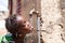 Healthy Fresh Water drips from Tap into African Child`s Mouth