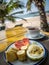 Healthy fruit breakfast on the sunny beach