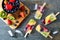 Healthy fruit summer ice pops, top view scene on a dark background