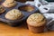 Healthy fruity muffins - blueberry muffin with muffin pan in background