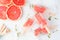Healthy grapefruit and thyme ice pops, top view scene on a marble background