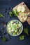 healthy green spinach smoothie bowl with blueberry, apple stars, kiwi, chia seed