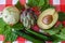 Healthy green vegetables from Israel market, fresh artichoke, cut avocado, nutritious kohlrabi, green cucumbers and spinach