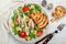 Healthy Grilled Chicken Caesar Salad with iceberg or lettuce, Cheese Parmesan, cherry tomatoes, bread Croutons and gourmet sauce