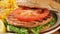 Healthy grilled salmon burger on a bun