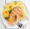 Healthy grilled salmon steak on linguine