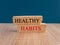 Healthy habits symbol. Concept word Healthy habits on brick blocks.