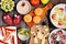 Healthy Halloween fruit treats, top view table scene over a rustic wood background