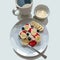 A Healthy Happy Breakfast . A Bowl of banana, strawberry, and blueberries. And a mug black coffee. Fashion background vector