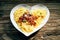 Healthy heart-shaped dish of Italian spaghetti