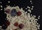 healthy hearty tasty oatmeal with berries and fruits raspberry blackberry apple on a black kitchen board on a dark background