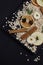 healthy hearty tasty oatmeal with berries and fruits raspberry blackberry apple on a black kitchen board on a dark background