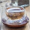 Healthy herbal lavender tea in oriental glass cup, square format