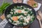 Healthy home made Green shakshuka. Fried eggs with wild galic and feta cheese