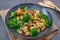 Healthy home made roasted italian gnocchi with bacon and broccoli