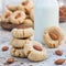 Healthy homemade almond cookies without butter and flour, served with a milk, square format