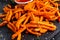 Healthy Homemade Baked Orange Sweet Potato Fries with Ketchup, herbs, salt and pepper.